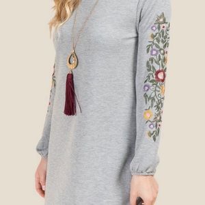 Sweater dress with embroidered sleeves